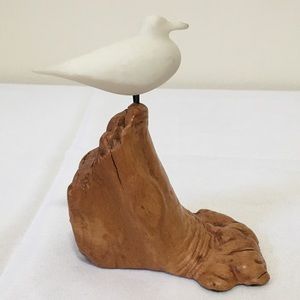 Seagull perched on driftwood nautical decor nature